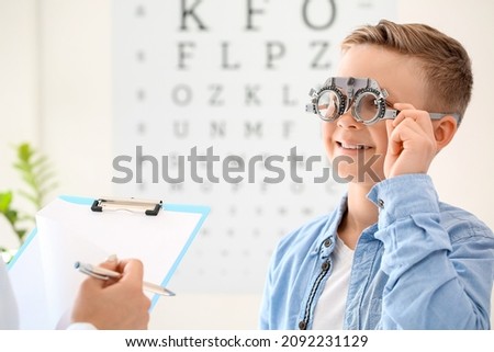 Little boy undergoing eye test in clinic Royalty-Free Stock Photo #2092231129