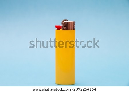 Yellow cigarette lighter centered and isolated. Royalty-Free Stock Photo #2092254154