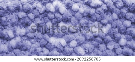 The background of fluffy material in the new trendy color of 2022 year Very Peri. Texture top view. Blog backdrop for text signs design. Abstract wallpaper, textile surface. Horizontal banner