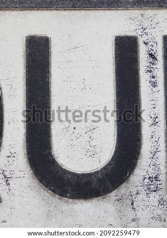 A Written Wording in Distressed State Typography Found Letter U