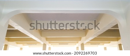 White and yellowish concrete building beams of a building