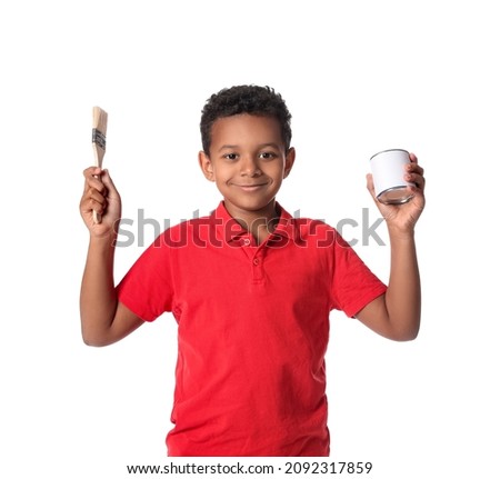 Little African-American boy with paint can and brush on white background