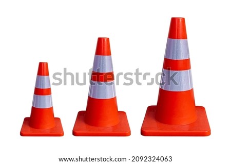 Three red traffic cones of different sizes(small, medium and large) isolated on white background with clipping path.