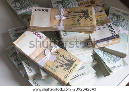 Stack of Korean 50000 Won banknote bills isolated Royalty-Free Stock Photo #2092342843