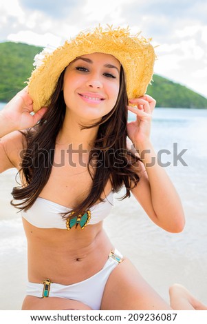 Beautiful young multicultural woman enjoying a Caribbean beach in Saint John in the United States Virgin Islands.