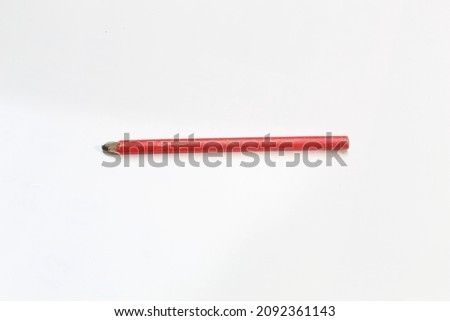 photo of a red pencil on a white background