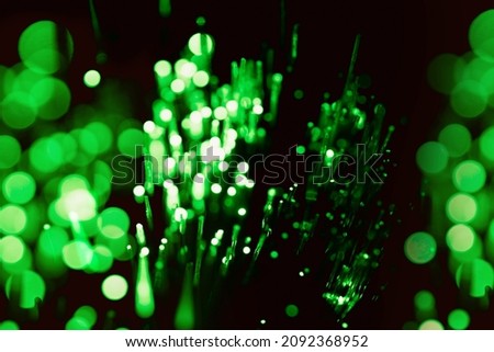 abstract green on black bokeh background overlay layer. sparks and blowing. festive background. Sparkling magical dust particles.