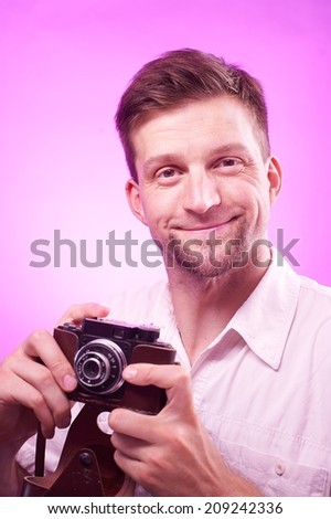 Professional photographer takes pictures with joy