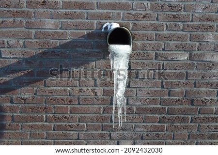frozen water tube with icicles