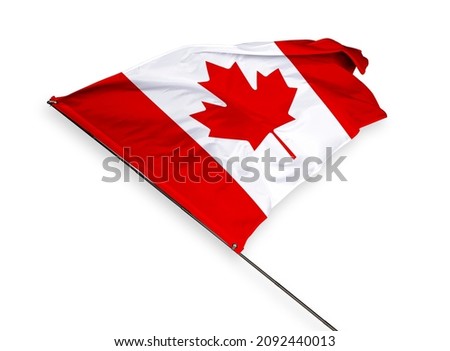 Canada's flag is isolated on a white background. flag symbols of Canada. close up of a Canadian flag waving in the wind.