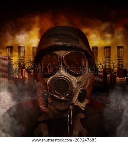 A soldier is wearing a gas mask in a polluted, scary city with smokestacks in the background for a war or hazard concept.