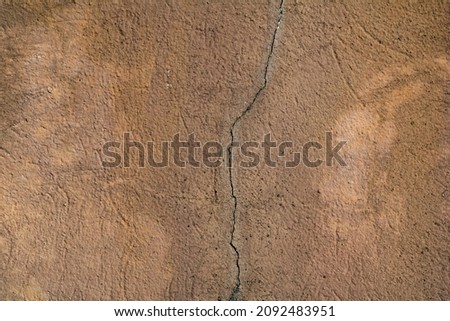 Cracked and abstract grunge texture. Aged material surface backdrop. Weathered effect pattern. Old and dirty background. Graphic resource.