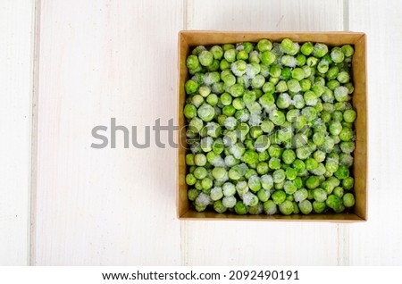 Frozen green peas, preservation of vitamins and vegetables. Photo
