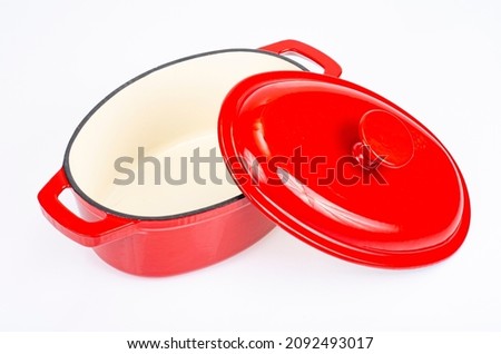 Red ceramic cast iron casserole dish. Studio Photo. Royalty-Free Stock Photo #2092493017