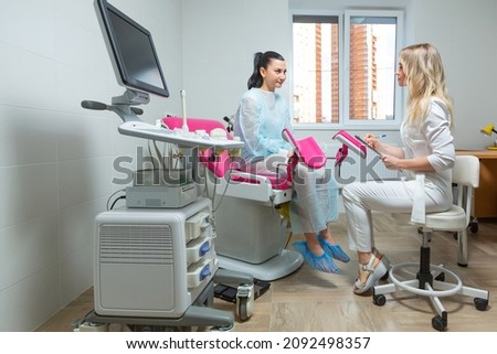 Photo of a gynecologist doctor and a patient on a gynecological chair. Preventive reception, preparation for medical examination, pregnancy management, health care gynecology contol Royalty-Free Stock Photo #2092498357
