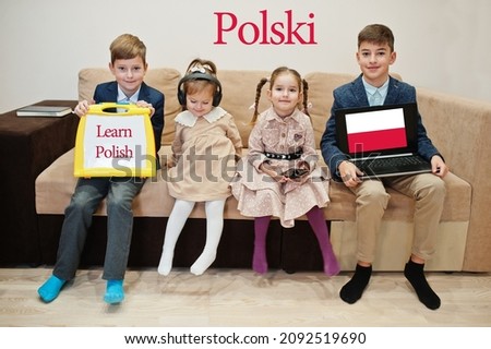 Four kids show inscription learn polish. Foreign language learning concept. Polski. Royalty-Free Stock Photo #2092519690