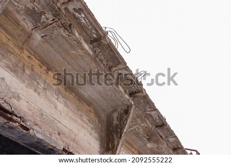 An old dilapidated concrete bridge across the river. Royalty-Free Stock Photo #2092555222