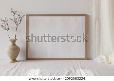 Wooden photo frame mockup with vase