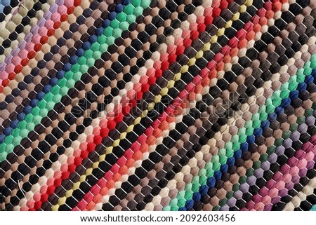 background multi-colored fabric pattern, obliquely to the right. Royalty-Free Stock Photo #2092603456