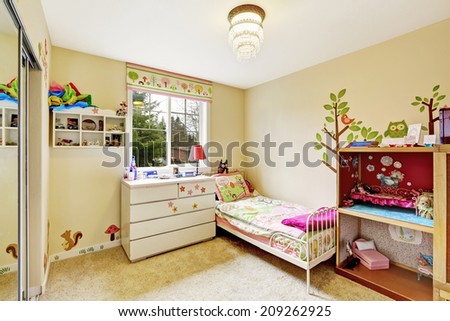Kids room interior in soft ivory with carpet floor. Furnished with single bed, dresser and cabinet