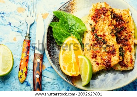 Fish fillet grilled with orange, delicious seafood.