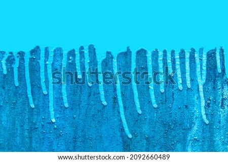 Blue paint strokes brush drops for text and design background surface wall.
