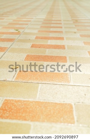 ceramic floor with brown and orange motifs photo