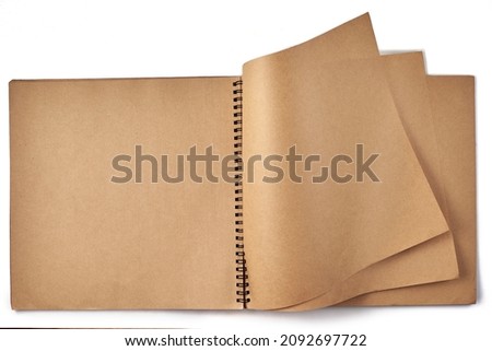 Opened album with sepia flipped pages and metal binding isolated on white background. Royalty-Free Stock Photo #2092697722