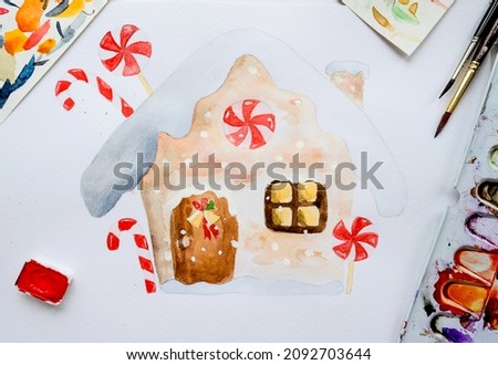 Christmas gingerbread house drawn with watercolor. New Year Xmas festive card painted with aquarelle