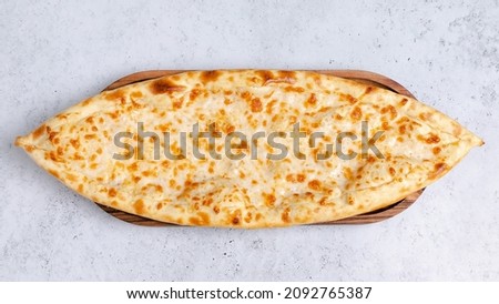 Cheese pide isolated on white close up top view
