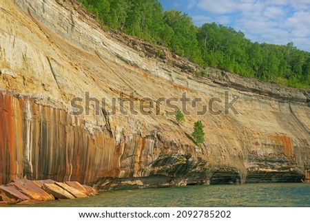 Landscape of the mineral stained, sandstone and eroded shoreline of Lake Superior, Pictured Rocks National Lakeshore, Michigan's Upper Peninsula, USA
