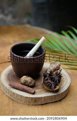 tea made of lemon grass and spices on wooden table