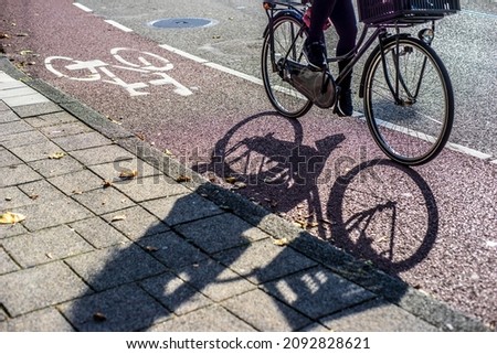 shadow of a bicycle on the road