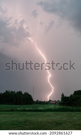 Lightning strike during the summer dramatic skies midsummer eve fields forests 
