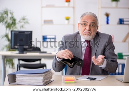 Old male employee in remuneration concept Royalty-Free Stock Photo #2092882996
