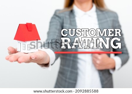 Sign displaying Customer Rating. Conceptual photo Each point of the customers enhances the experience A Young Lady Businesswoman Holding Presenting Home In Business Outfit