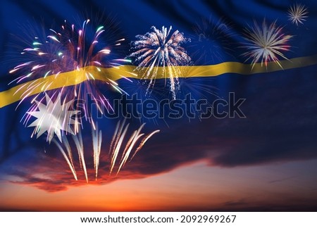 Majestic fireworks in evening sky and flag of Nauru for Independence day or National Holiday