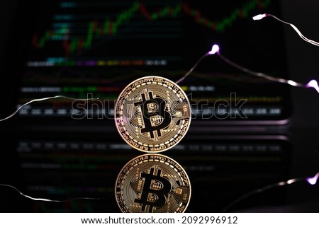 a close up of a bitcoin coin against a dark background