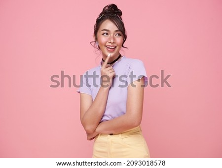 Young happy asian teen woman thinking something isolated on pink background.	 Royalty-Free Stock Photo #2093018578