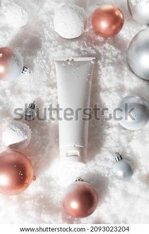 white snow background with lifestyle, cosmetic makeup bottle lotion cream product mockup with beauty fashion skincare for merry christmas festival gift