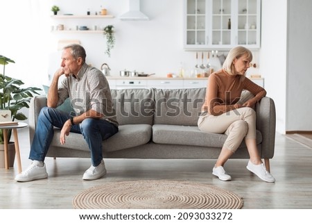 Marital Crisis Problem. Offended Mature Spouses Sitting Back-To-Back Not Speaking After Quarrel On Sofa At Home. Senior Spouses Thinking About Divorce Having Conflict. Issues In Relationship Royalty-Free Stock Photo #2093033272