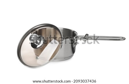 New shiny saucepan with glass lid isolated on white