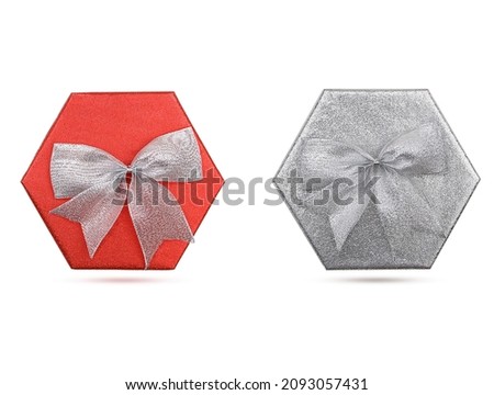 Two shiny holiday boxes with bow on white isolated background. Red and silver. Holiday, New Year, Christmas, Birthday, Mother's, International Women's, Valentine's Day. Copy space