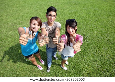 happy students in campus showing sign thumb up, asian