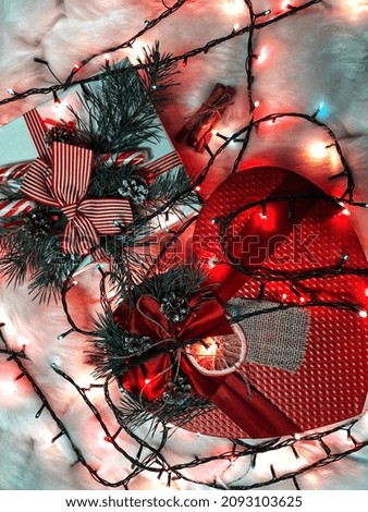 Christmas holidays composition with gift boxes on wooden background. New Year decorations. Тоp view