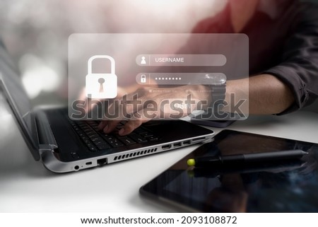 The account of a businessman with a laptop computer is safe. Hacking a Phishing mobile phone with a password to get access to a phone,internet security issues,and fraud are all examples of the notion. Royalty-Free Stock Photo #2093108872