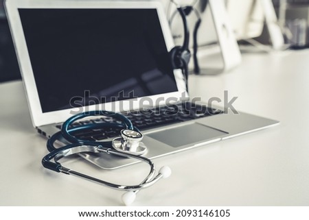 Headset and doctor equipment at clinic ready for actively support for patient by online video call . Concept of telehealth and telemedicine service .