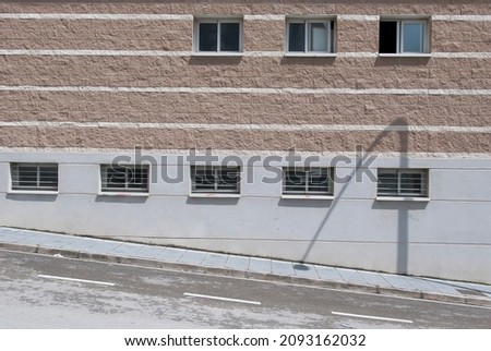 a wall with several windows