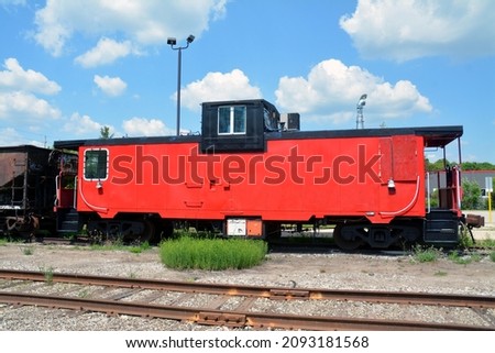 Caboose on railway tracks daytime
 Royalty-Free Stock Photo #2093181568