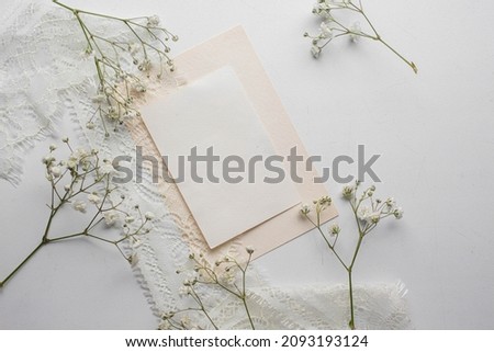 card mockup with white flowers and envelope. wedding invitation 